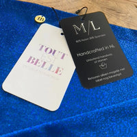 TOUTESTBELLE kledinglabels en luxe materialen – handgemaakte kwaliteit